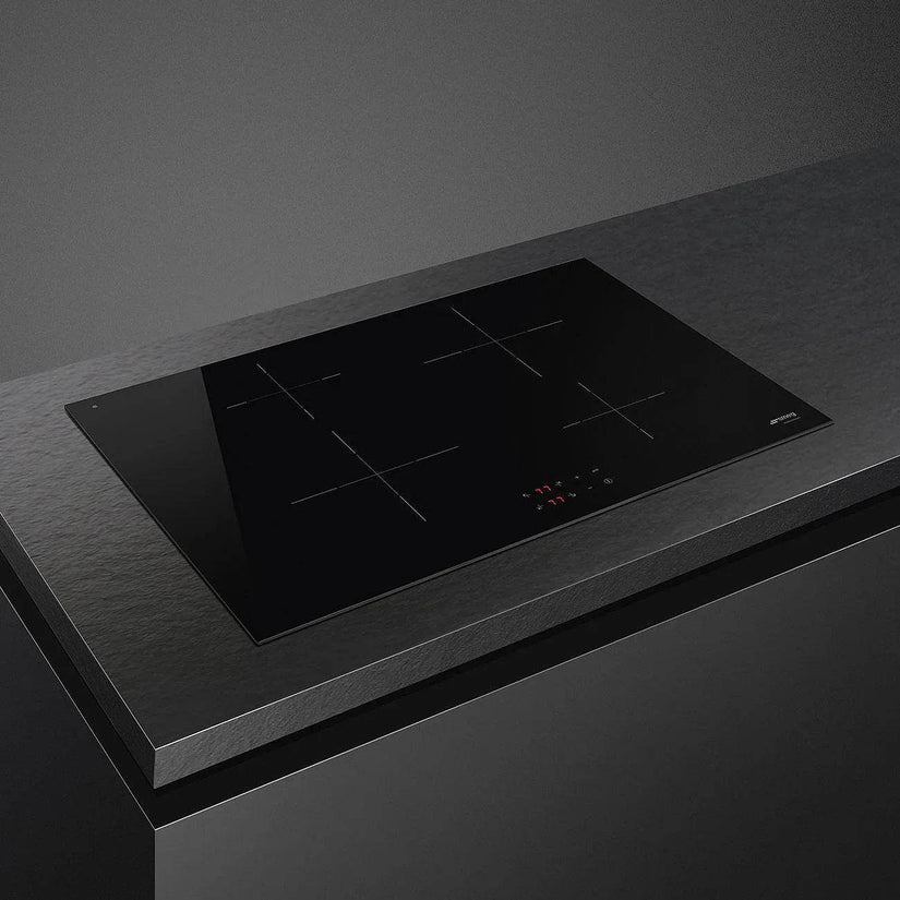 Smeg Universal 70/75cm Induction Hob, Black Glass - Carvers Interiors - Cookers and Bathroom Showroom Wolverhampton